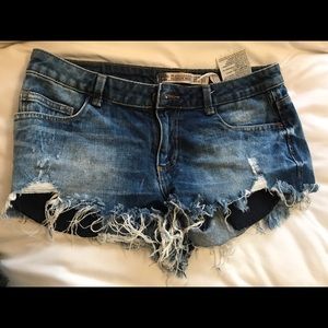 Distressed denim shorts